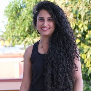 Heena Talreja - Long curly hair content creator